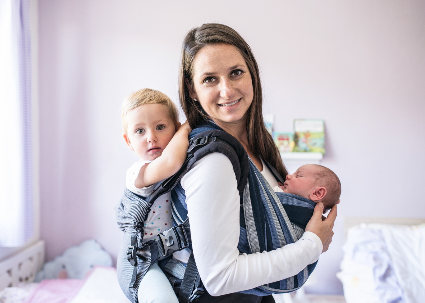 Mother with Her Children in Sling and Baby Carrier